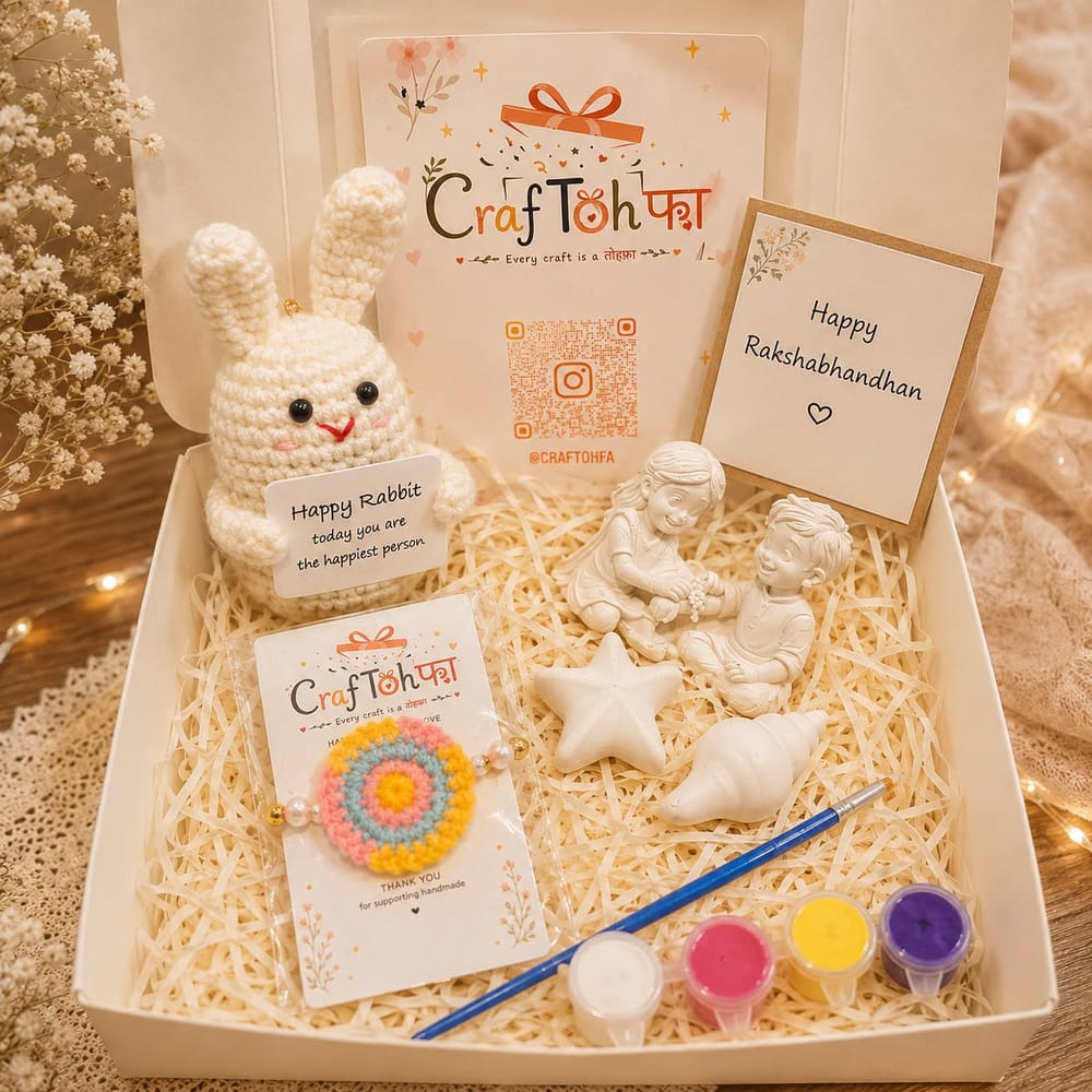 Bunny combo box with a cream crochet bunny holding a note, a rainbow crochet charm, an idol, a starfish and a shell to paint with four paint pots